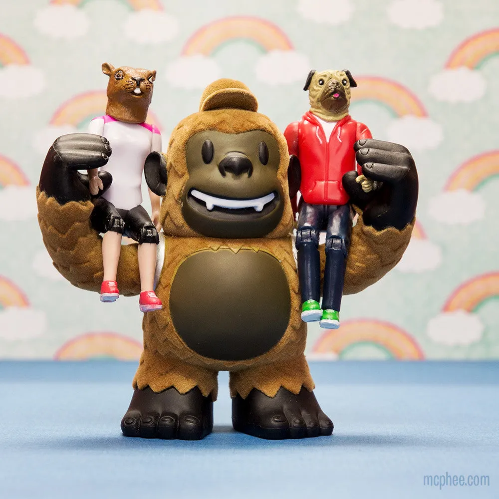 Large Freddie Mailchimp action figure holding two smaller figures