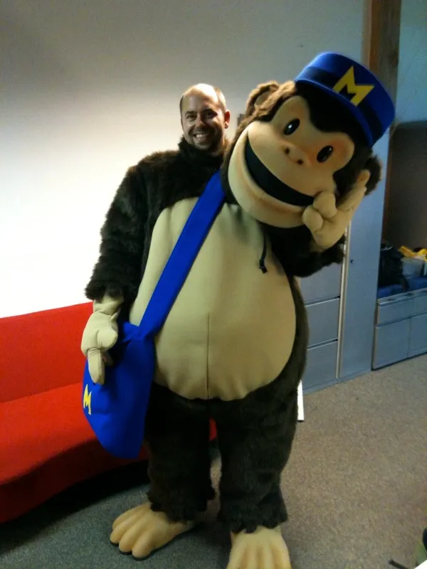 Life-size Freddie mascot costume posing with a person