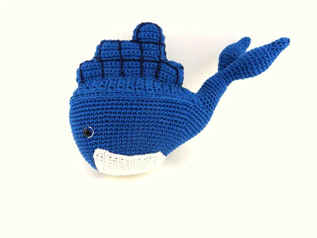 A large crocheted Docker whale with containers on its back