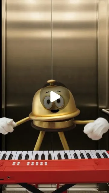 Bellboy playing a keyboard inside a hotel elevator