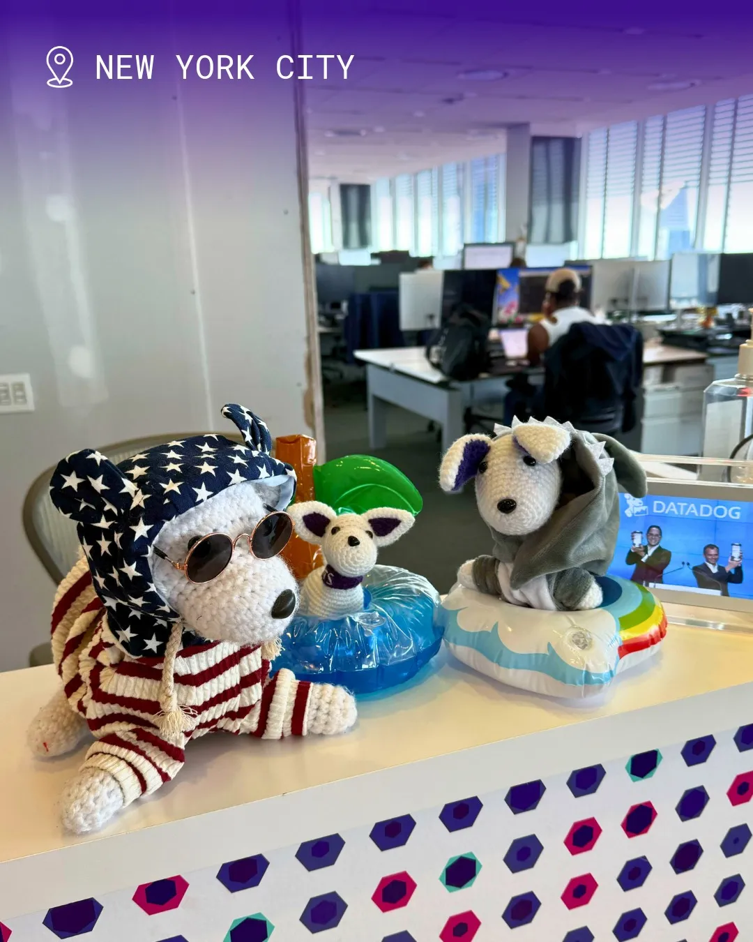 Three handmade Datadog Bits mascots displayed in the New York City office